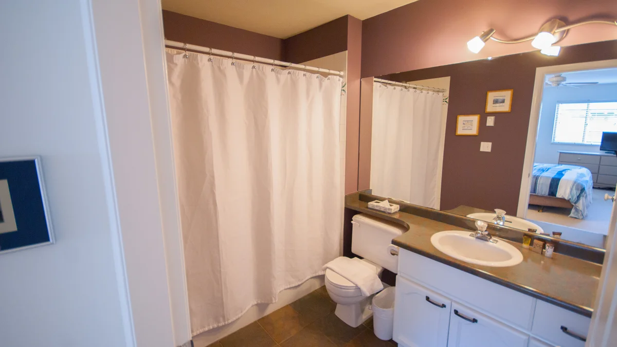 Master washroom has a shower-tub combo
