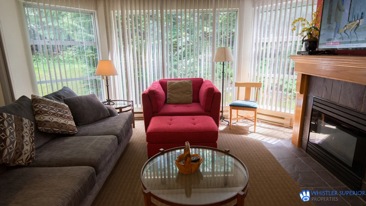 Cozy living room with view of woods