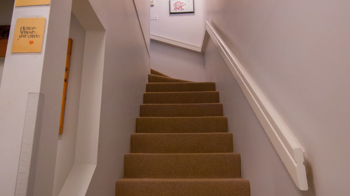 stairs to the third floor where bedrooms are located