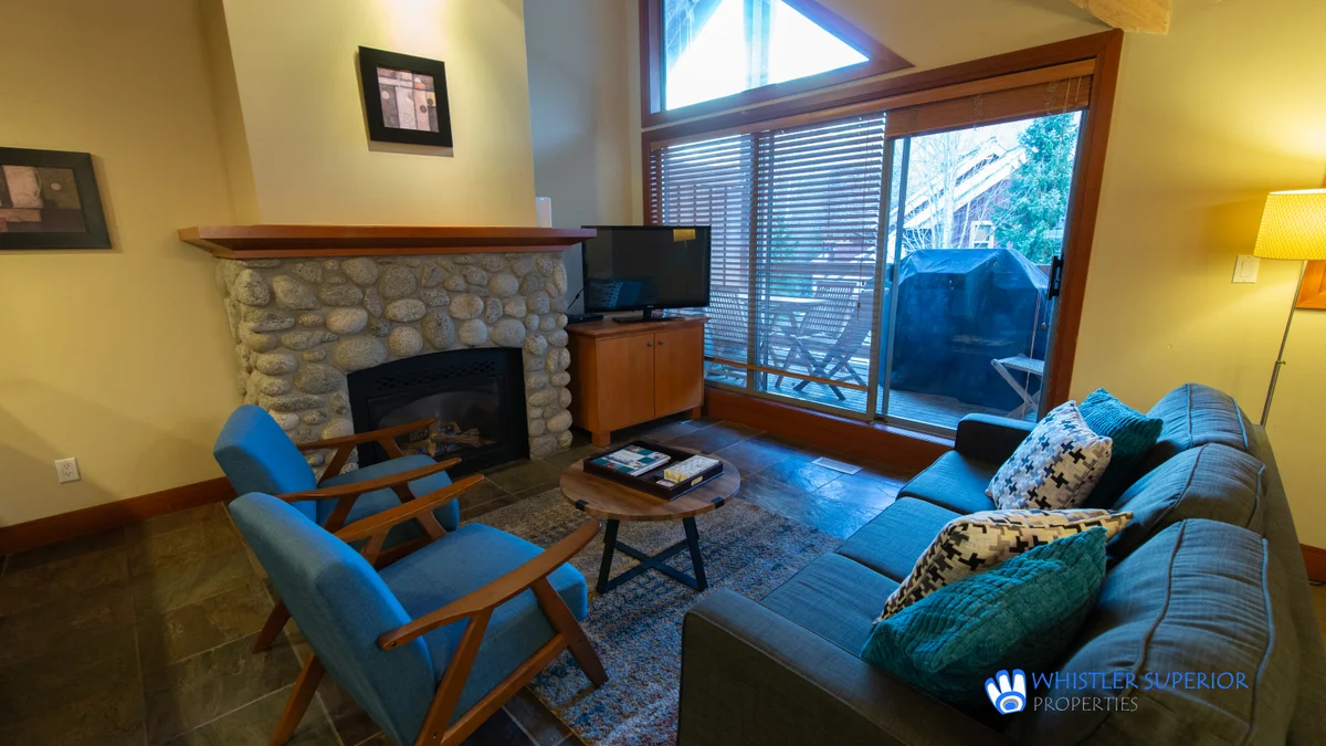 Living area with fireplace and TV